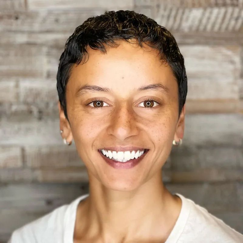 Lucy, massage therapist at Habari House, smiling